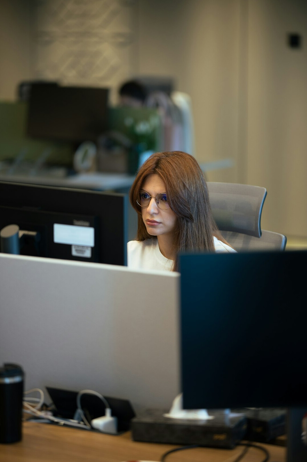 professional woman coding at desk